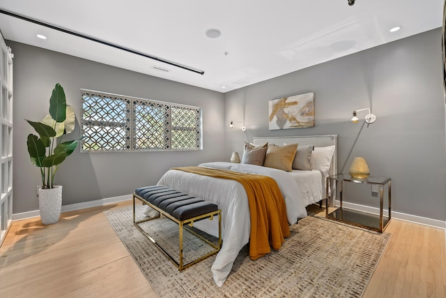 bedroom with light hardwood / wood-style flooring