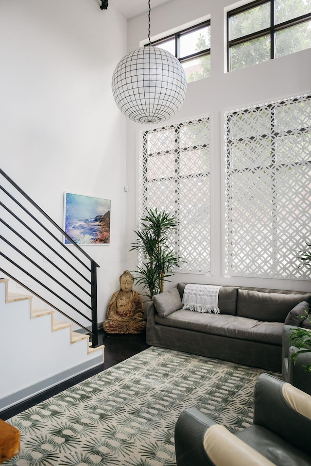 129 Walnut St Unit 23, Chattanooga, TN 37403 - living area with carpet floors, stairs, and a high ceiling