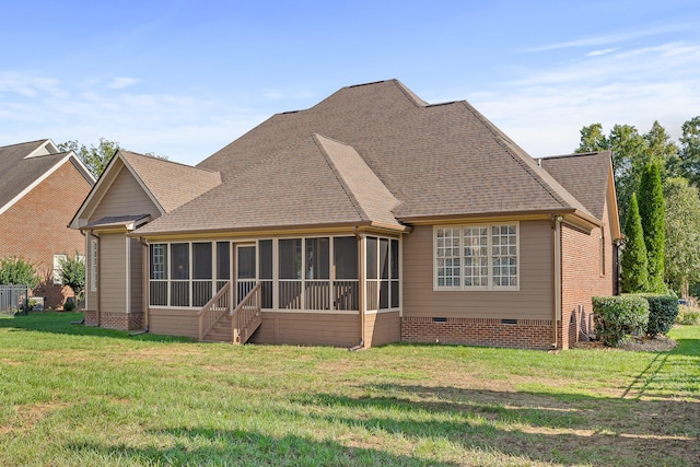 back of house featuring a yard and a sunroom