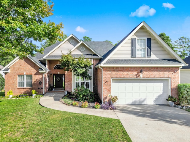 view of front property with a garage and a front lawn