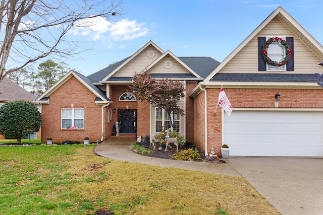 view of front of property featuring a front lawn and a garage