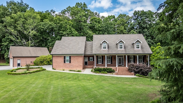 cape cod house with a front lawn and a porch