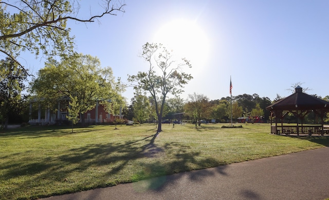 exterior space with a gazebo and a lawn