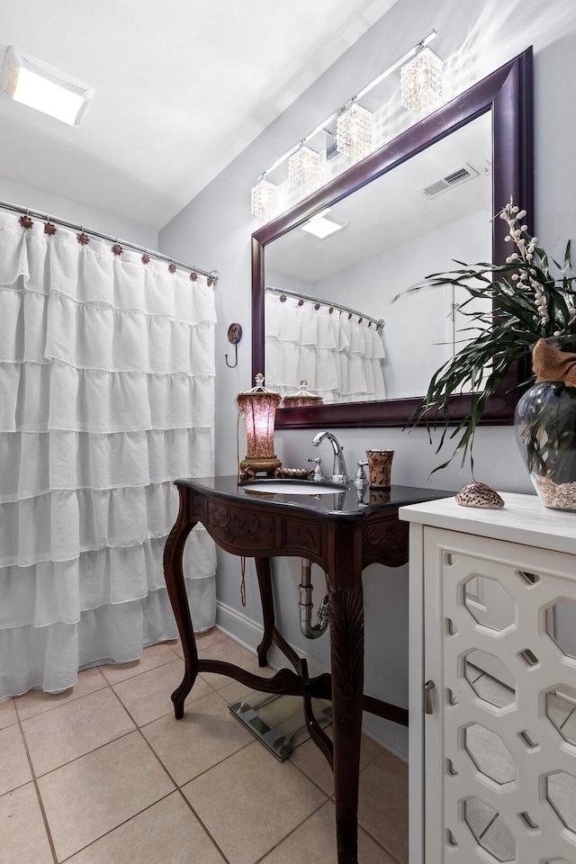 bathroom with sink and tile patterned floors