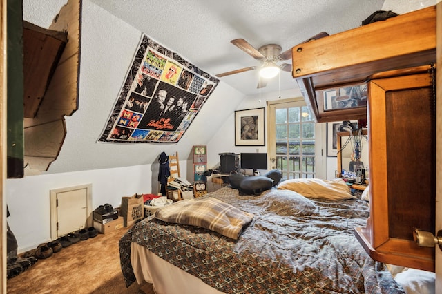 carpeted bedroom featuring ceiling fan, a textured ceiling, and lofted ceiling