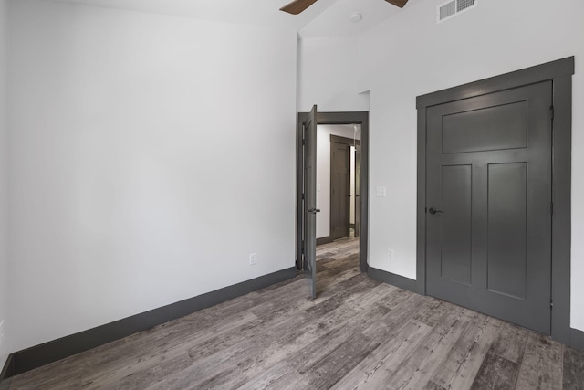 unfurnished bedroom with hardwood / wood-style flooring and ceiling fan