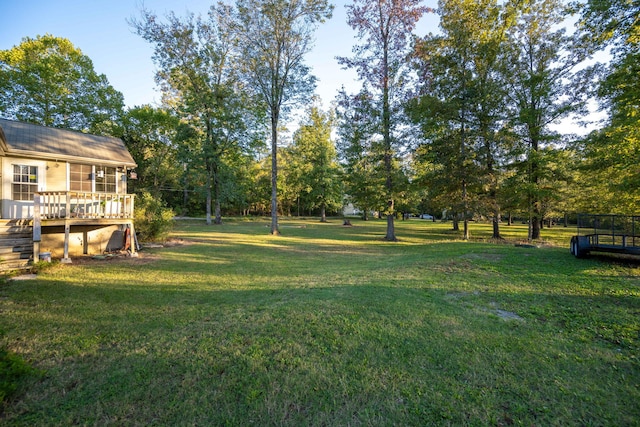 view of yard with a deck