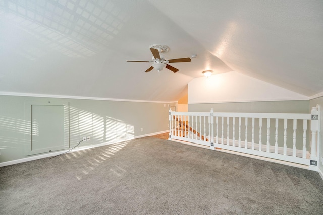 additional living space with ceiling fan, carpet, and lofted ceiling