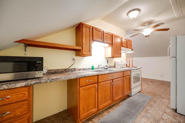 kitchen with lofted ceiling, sink, white appliances, and ceiling fan