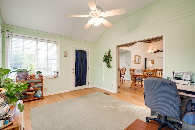 home office with ceiling fan, lofted ceiling, and light wood-type flooring