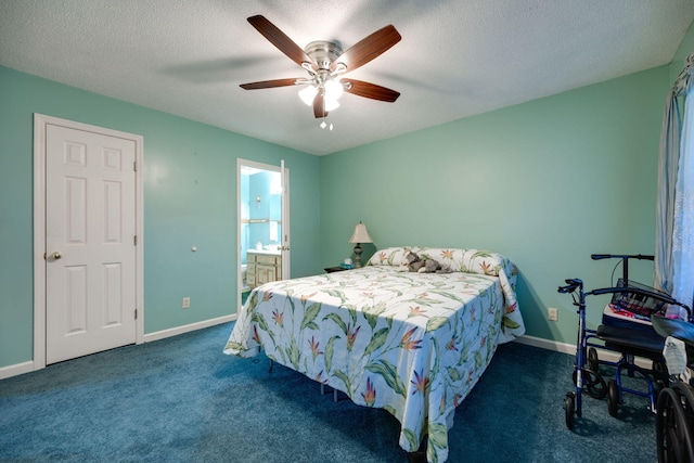 bedroom featuring dark colored carpet, a textured ceiling, and ceiling fan