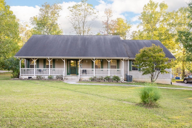 view of front of home with a front lawn, central AC unit, and a porch