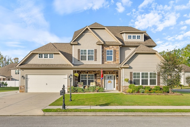 craftsman-style home featuring a garage and a front lawn