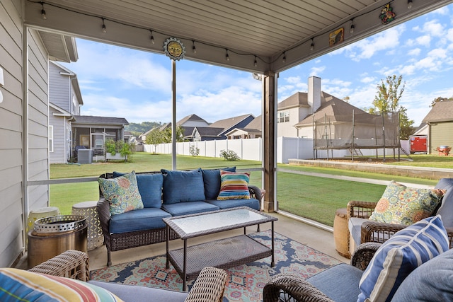 view of patio / terrace featuring a trampoline and an outdoor living space