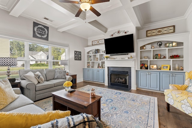 living room with ceiling fan, beam ceiling, a tiled fireplace, dark wood-type flooring, and coffered ceiling