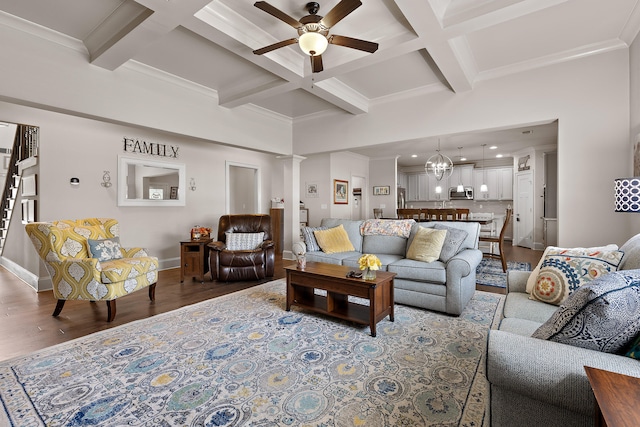 living room with coffered ceiling, ceiling fan with notable chandelier, beam ceiling, decorative columns, and hardwood / wood-style floors