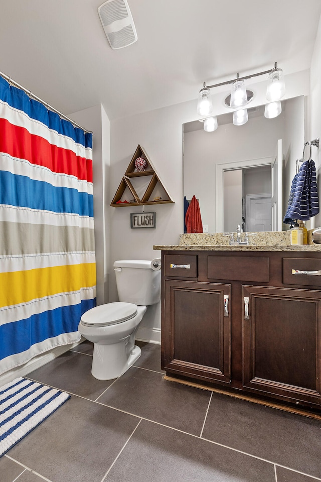 bathroom featuring walk in shower, vanity, and toilet