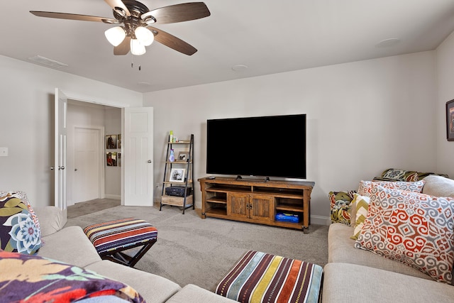 living room featuring ceiling fan and light carpet