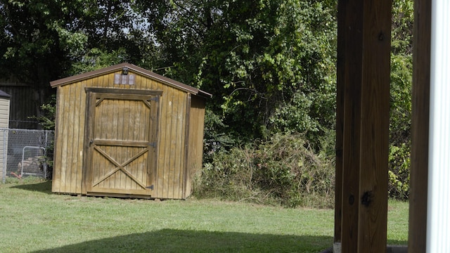 view of outbuilding featuring a yard