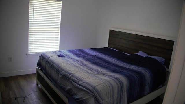 bedroom featuring dark hardwood / wood-style floors