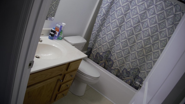 full bathroom with tile patterned flooring, shower / bath combo, vanity, and toilet