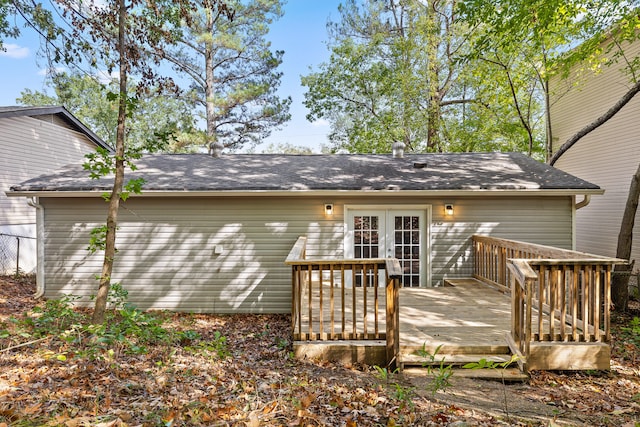 rear view of property featuring french doors and a deck