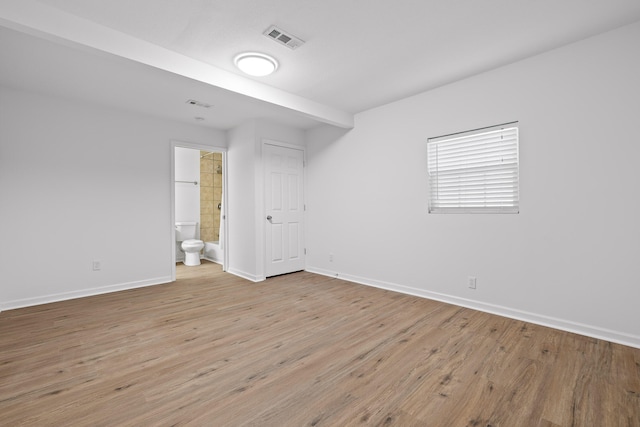 spare room featuring light wood-type flooring