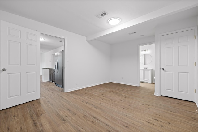 unfurnished room featuring light wood-type flooring