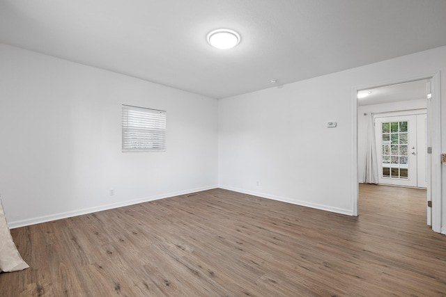 empty room featuring hardwood / wood-style flooring