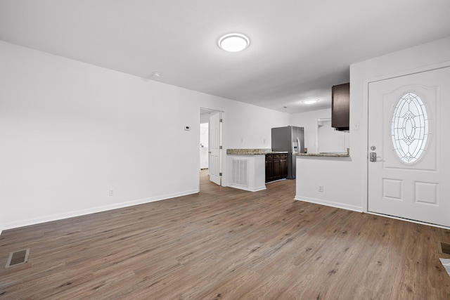 entrance foyer with light hardwood / wood-style floors