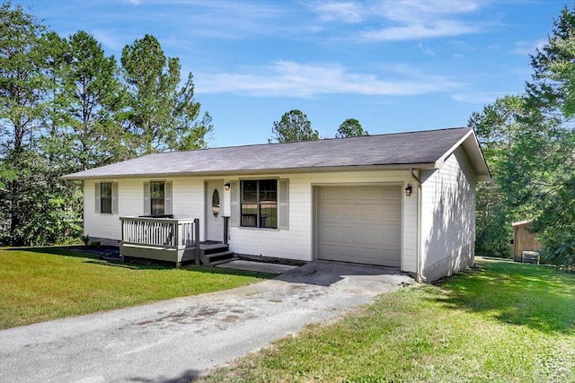 single story home featuring a garage and a front lawn