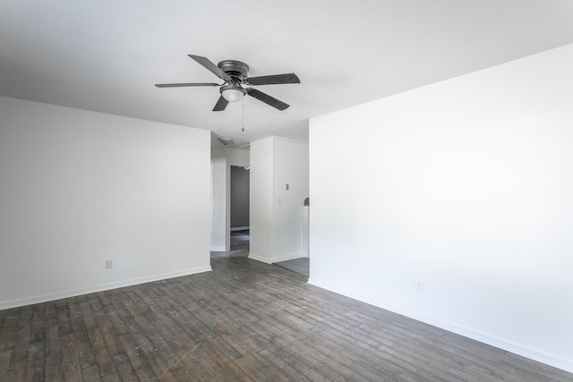 spare room featuring ceiling fan and dark hardwood / wood-style floors