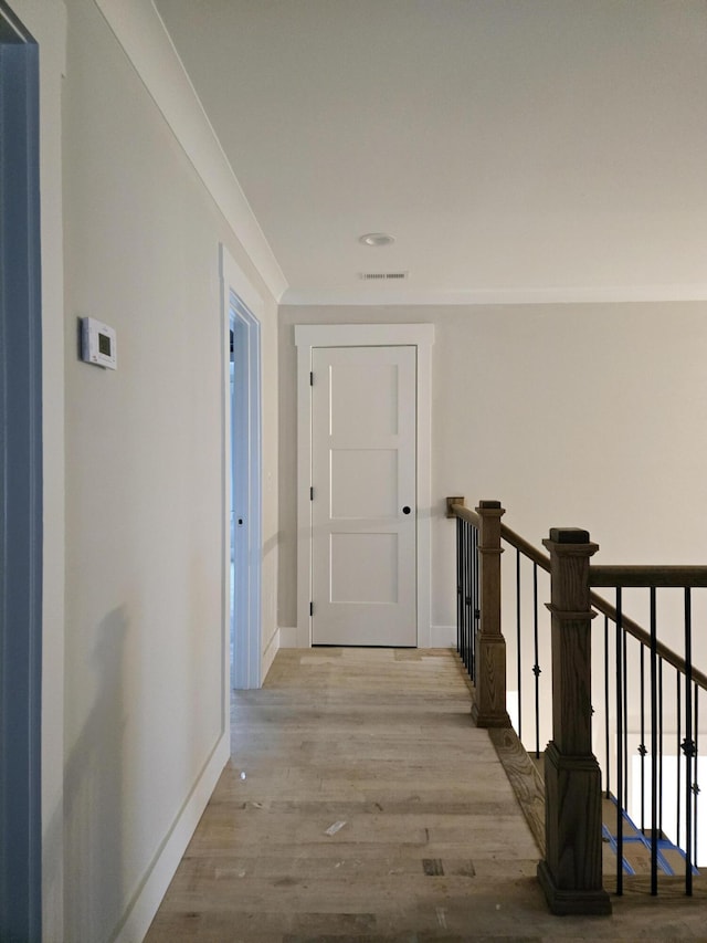 hall with light hardwood / wood-style floors