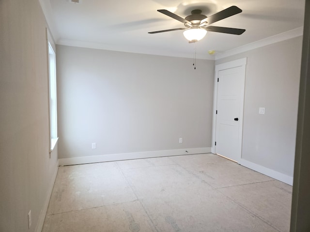 unfurnished room with ceiling fan and ornamental molding