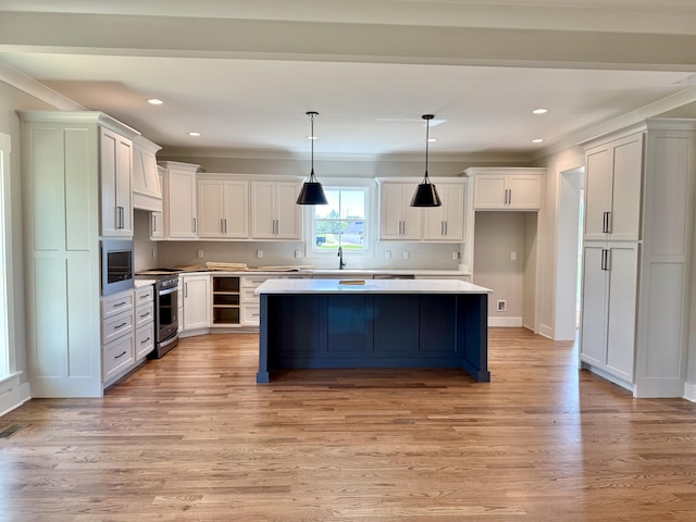 283 Quartz Dr Unit 22, Chickamauga, GA 30707 - kitchen featuring stainless steel range with electric cooktop, crown molding, built in microwave, a sink, and a center island