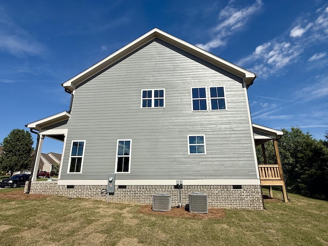 283 Quartz Dr Unit 22, Chickamauga, GA 30707 - view of property exterior featuring crawl space, a yard, and central AC