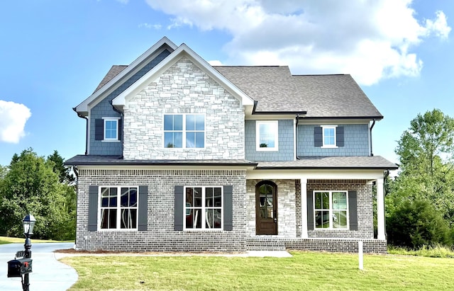 283 Quartz Dr Unit 22, Chickamauga, GA 30707 - view of front of house with a porch, a front yard, stone siding, and roof with shingles