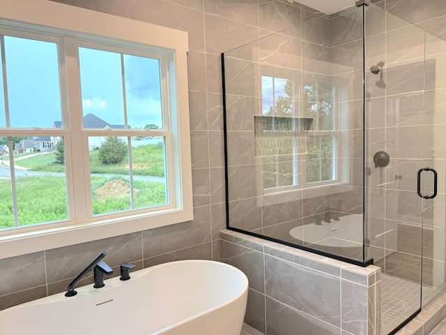 283 Quartz Dr Unit 22, Chickamauga, GA 30707 - full bath with a stall shower, a soaking tub, tile walls, and a sink