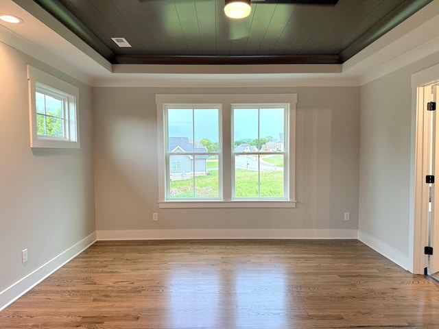 283 Quartz Dr Unit 22, Chickamauga, GA 30707 - empty room featuring a tray ceiling, wood finished floors, baseboards, wood ceiling, and crown molding
