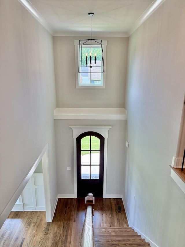 283 Quartz Dr Unit 22, Chickamauga, GA 30707 - foyer entrance with wood finished floors, plenty of natural light, a chandelier, arched walkways, and crown molding