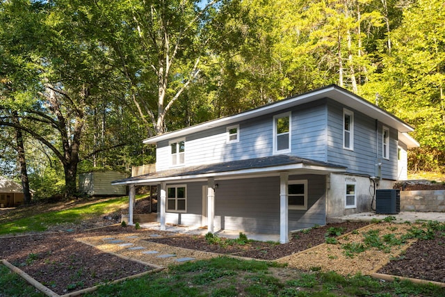 exterior space with central AC unit and a patio area