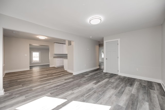 unfurnished room featuring hardwood / wood-style flooring