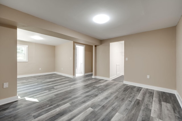 unfurnished room with hardwood / wood-style flooring