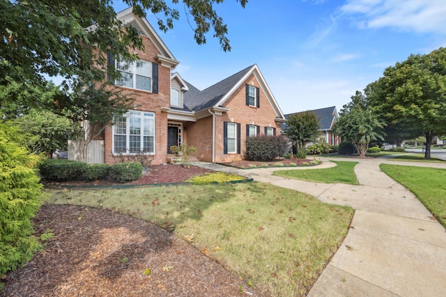 craftsman inspired home with a front lawn