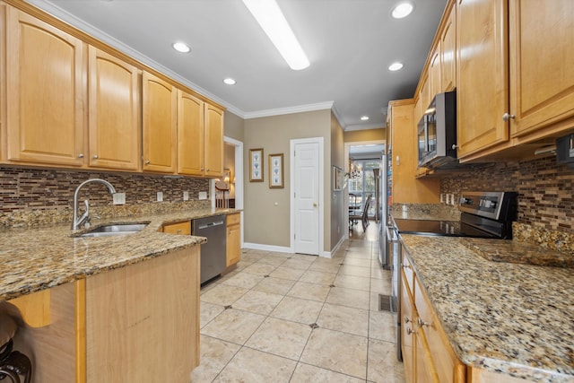 kitchen featuring light stone counters, ornamental molding, sink, tasteful backsplash, and stainless steel appliances