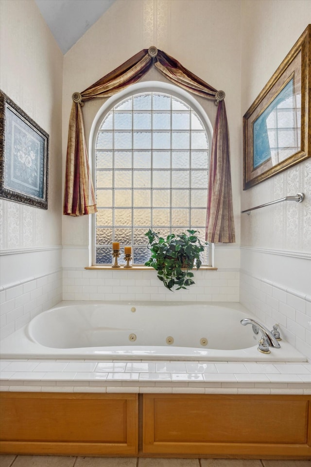 bathroom featuring tiled bath