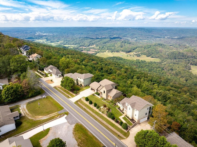 bird's eye view featuring a residential view and a forest view