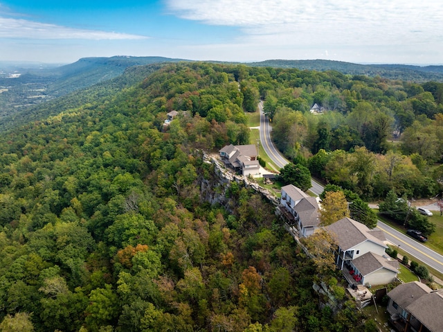 drone / aerial view featuring a forest view