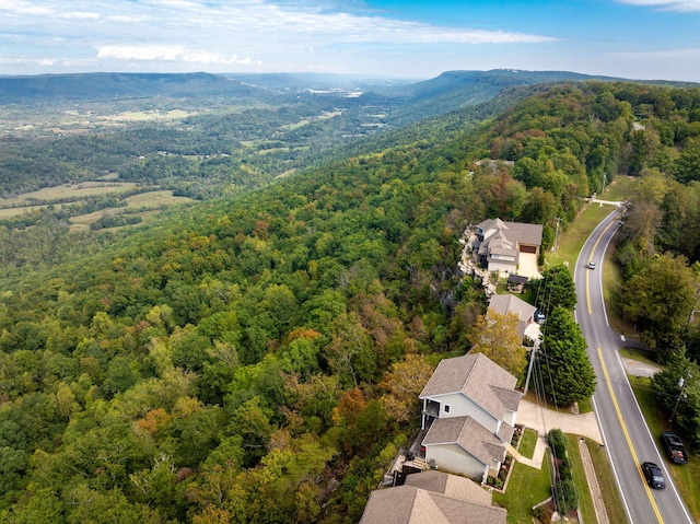 drone / aerial view featuring a view of trees