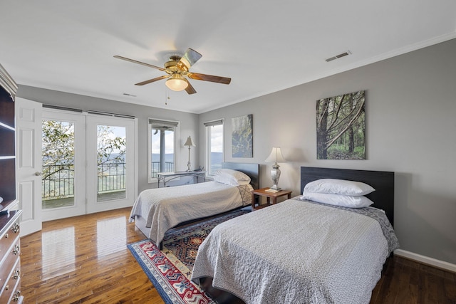 bedroom featuring dark wood-style floors, access to outside, visible vents, and crown molding